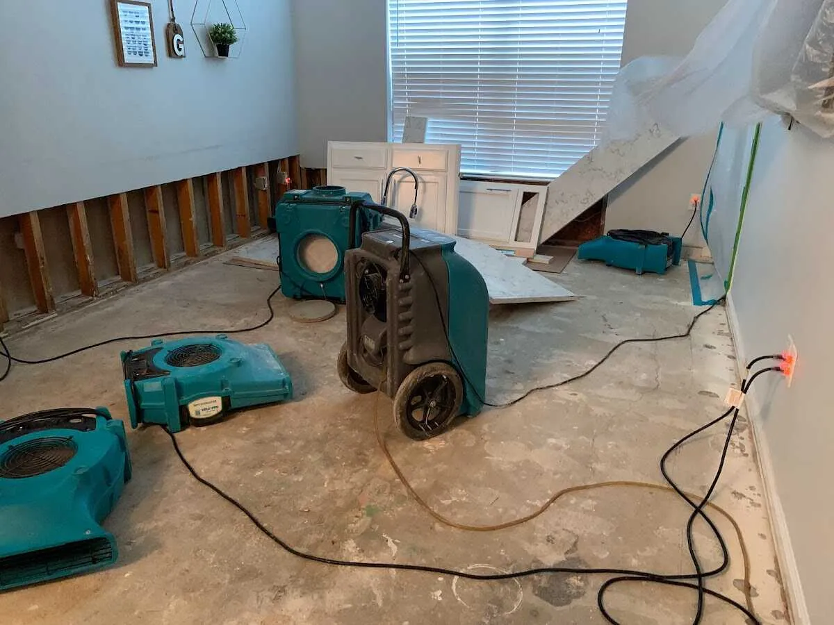 Dehumidifier in flood-cut room for Water Damage Restoration in Gardere